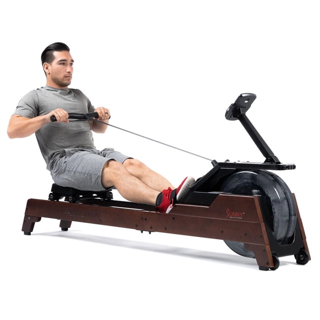 Sunny Health & Fitness Elite Water Rowing Machine with High Resistance Vertical Tank featuring a brown steel frame, black water tank with 16 hydro blades angled at 60 degrees, adjustable magnetic resistance, large LCD console, padded seat, anti-slip foot pedals, and Bluetooth connectivity via SunnyFit app, ideal for indoor cardio workouts.