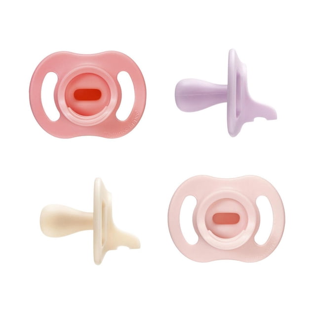 Tommee Tippee Ultra-light StayPut Pacifier, 0-6m, 4 Count, one-piece silicone pacifiers in pastel pink, lavender, cream, and light pink shown from front and side views, featuring symmetrical nipple and shield for a comfortable fit, designed to stay put longer and compatible with pacifier clips.