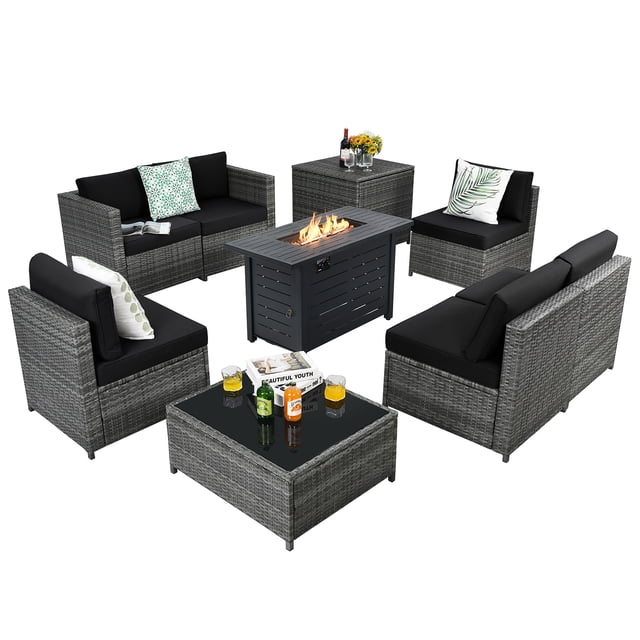 Patiojoy 9 PCS Rattan Dining Set with black wicker sofas, a propane gas fire pit table emitting flames, and a glass-top coffee table. Includes six cushioned seats, a storage box, and a versatile fire pit table with 60,000 BTU heat output. Designed for outdoor use, the set features durable PE rattan and steel construction with a load-bearing capacity of 2240 lbs. Ideal for patio furniture setups and outdoor conversation areas.