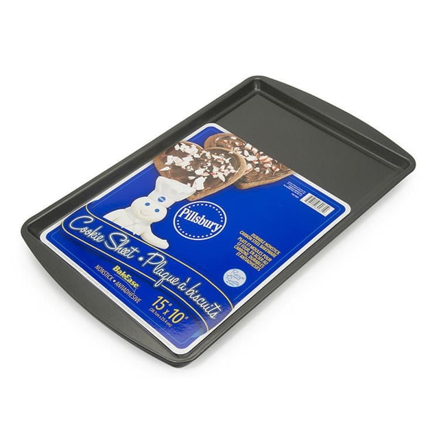 Pillsbury Non Stick Medium Cookie Sheet 15 by 10 inches, rectangular carbon steel baking sheet with nonstick surface and raised edges, featuring Pillsbury Doughboy label with chocolate cookies, suitable for baking and roasting tasks with easy cleanup.