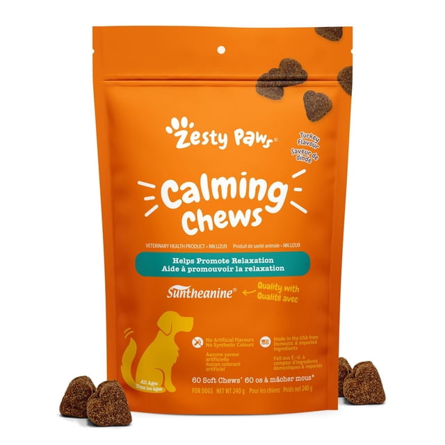 Zesty Paws Calming Turkey Daily Soft Chews Dog Supplement in an orange resealable pouch with white and teal text, featuring 60 heart-shaped turkey-flavored soft chews with Suntheanine and Ashwagandha to promote relaxation and calmness for dogs of all ages, shown with several chews outside the bag.