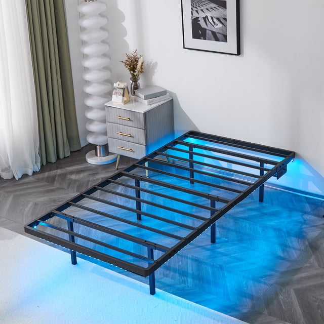 ktaxon Twin 14" Floating Bed Frame with USB Charging and LED Lights, Metal Platform Bed, Black. A modern black metal bed frame with a floating design, RGB LED lighting underneath, and a USB charging port on the side. Ideal for contemporary bedroom furniture setups, it supports up to 550 lbs and is suitable for compact spaces.
