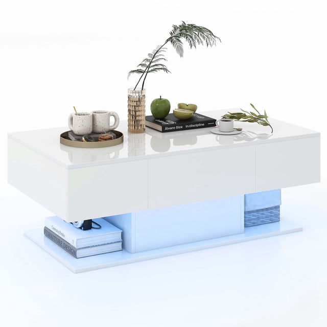 Costway LED Coffee Table with 2 Drawers, featuring a white high-gloss finish and 20-color dimmable LED lights controlled via remote. The table includes a spacious tabletop for decor and essentials, two push-to-open drawers, and a bottom open shelf for additional storage. The LED lighting offers 22 dynamic modes and is powered by a USB cable. Ideal for modern living rooms, the table measures 43.5 inches in length, 23.5 inches in width, and 16 inches in height.