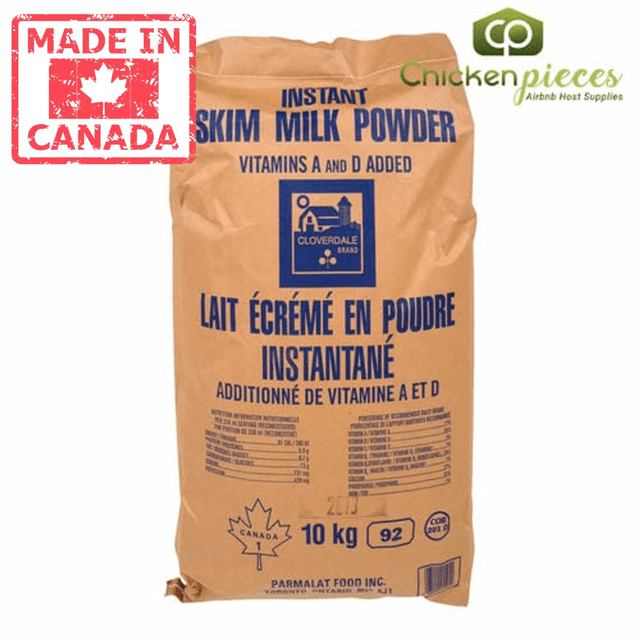 Cloverdale Milk Skim Instant Powder 10 KG/22lbs - Canadian Made. A large brown bag of instant skim milk powder with blue text, featuring the Cloverdale brand logo and 'Made in Canada' label. The packaging highlights vitamins A and D added, and the product is suitable for baking, cooking, and beverage formulations. Ideal for culinary and industrial applications.