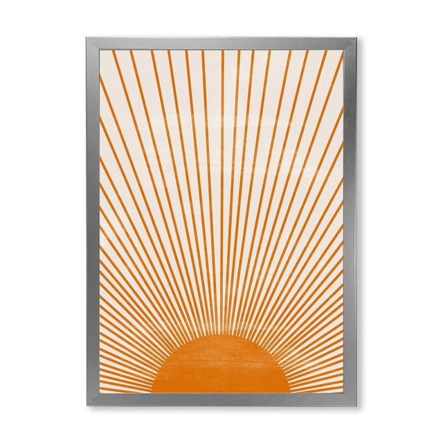 Designart Orange Sun Print III Framed Wall Art featuring a geometric orange sun with radiating lines on premium cotton canvas, mounted in a 1.5-inch silver frame. This modern canvas print arrives ready to hang with included hardware, suitable for enhancing contemporary home décor.