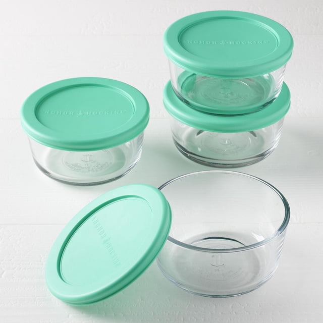 Anchor Hocking Ensemble 8 Pcs-2C RND Ajusté avec Couvercles Menthe avec Quatre Contenants Ronds en Verre Transparent de 2 Tasses pour Aliments et Couvercles Ajustés Vert Menthe Embossés avec le Nom de la Marque, Affichés Empilés et un Ouvert sur une surface Blanche. Ces Contenants en Verre Trempé Résistent aux Taches, aux Odeurs et au Gauchissement, Sécuritaires pour le four, le Micro-Ondes, le Lave-Vaisselle, le Réfrigérateur et le Congélateur, Protégeant la Saveur des Aliments. Convient Aussi à l'Organisation de Petits Articles d'Artisanat Ou de Fournitures de Bureau.