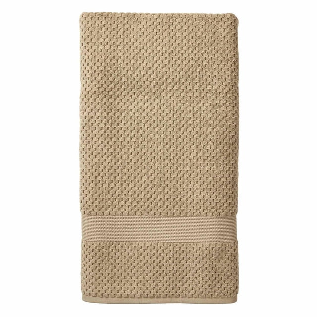 Better Homes & Gardens Signature Soft Popcorn Texture Towel Collection folded beige towel featuring popcorn texture and a smooth band, made of 90% US cotton and 10% viscose, extra absorbent and soft for kids' bathroom, also suitable for drying hands or face