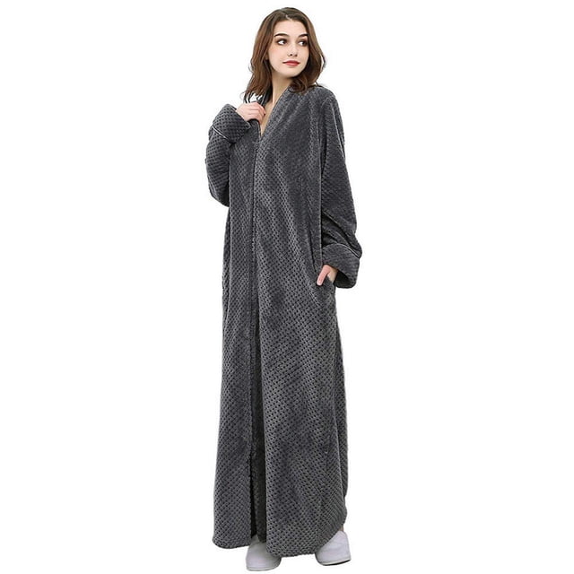 Women's Flannel Robe Zipper Front Long Plush Full Length Bathrobe with Pockets in grey, made of 100% polyester. This Artfasion robe features a full zipper closure, oblique V-neck, long sleeves, and two large pockets. The floor-length design offers warmth and comfort, suitable for lounging or as a gift. Available in sizes M to XL.