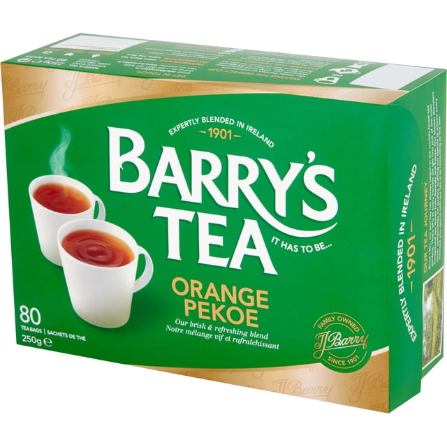Barry's Tea Orange Pekoe box with 80 tea bags and 250g weight, displaying two white cups of steaming black tea on a green and gold background, highlighting its expertly blended Irish black tea heritage since 1901 and family-owned brand, ideal for brewing brisk and refreshing tea.
