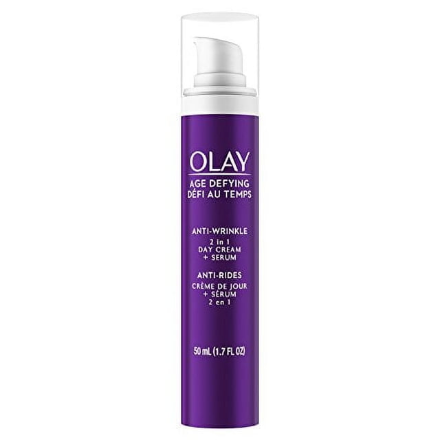 Olay Age Defying 2-in-1 Anti-Wrinkle Day Cream + Serum in a purple pump bottle with clear cap, labeled in English and French, containing 50 mL (1.7 fl oz), a lightweight moisturizer that firms skin and reduces wrinkles for daily face hydration.