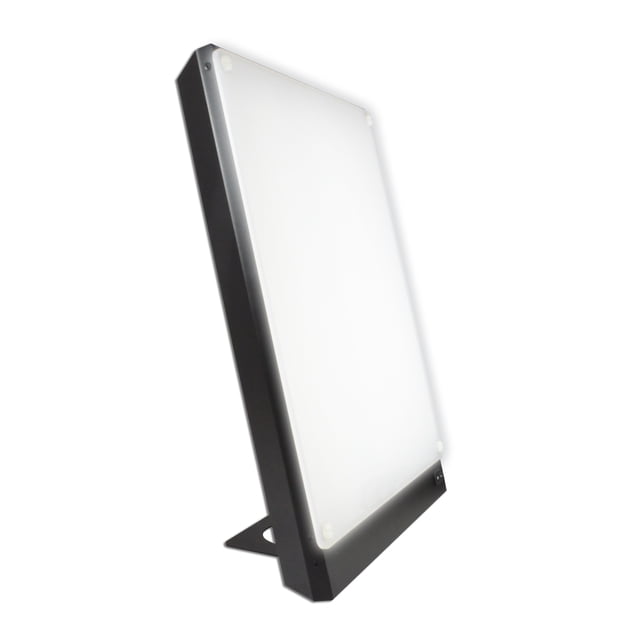 Northern Light Technologies Boxelite 10,000 Lux Light Therapy Lamp in black, featuring a large 12 x 15-inch front panel that emits diffuse full-spectrum light. Designed for natural mood and energy enhancement, this UV-free sunlight desk lamp delivers 10,000 lux at a comfortable 14-inch distance. The lamp includes a stand for vertical setup, ensuring maximum efficiency for light therapy or as a bright task light in dark spaces. Made in Canada with high-quality metal construction and backed by a 7-year warranty.