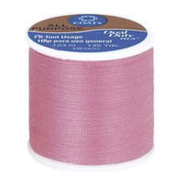 Coats & Clark All Purpose Polyester Thread spool in dusty pink, 123 metres of 100% polyester covered polyester thread for versatile hand and machine sewing on knits and woven fabrics, shown front-facing on white background, also suitable for craft projects requiring durable thread.