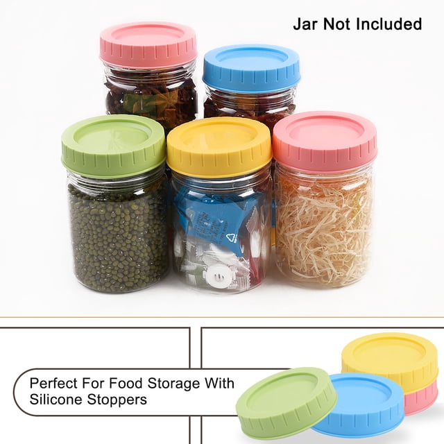 Colored Plastic Mason Jar Lids Regular Mouth Mason Canning Jars Top Food Storage Replacement 4 Pack. The image shows four colourful lids in green, blue, yellow, and pink, designed to fit regular mouth mason jars with a diameter of 70mm. These lids feature ribbed edges for easy grip and silicone sealing gaskets for leakproof food storage. The jars are not included.