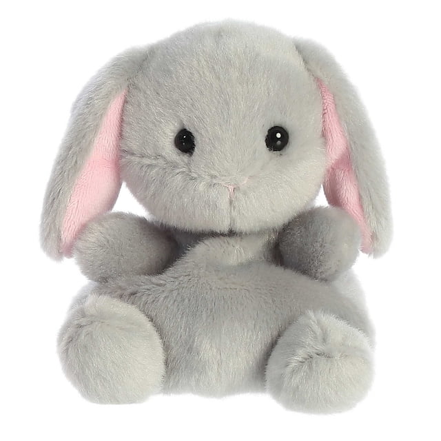 Aurora Palm Pals - Pebbles Bunny 5-inch plush toy featuring soft, slate-grey fur, long floppy ears lined with pale pink, and bright, sparkling eyes. This cuddly stuffed animal has a sweet embroidered nose and is filled with bean pellets for stability. Suitable for all ages and part of the #palmpalsparty collection.