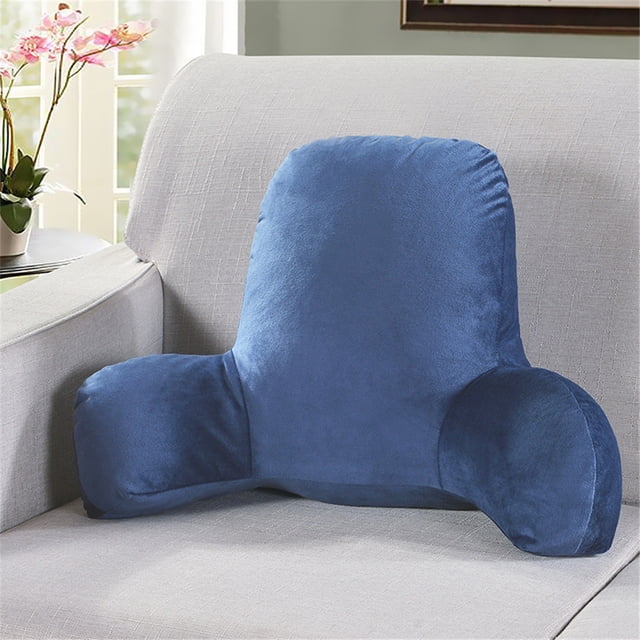 Mefallenssiah Plush Big Backrest Reading Rest Pillow Lumbar Support Chair Cushion with Arms in a soft blue plush material. The pillow features a tall backrest for support, two armrests for added comfort, and is filled with PP cotton for a cozy feel. It measures 52x38x20 cm and is displayed on a light grey sofa in a well-lit room with a floral arrangement in the background.