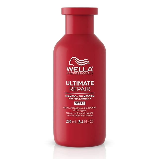 Wella Professionals ULTIMATE REPAIR Shampoo in an 8.4 fl oz (250 mL) red bottle. This professional lightweight cream shampoo is designed for damaged hair, featuring AHA and Omega-9 to replenish, repair, and moisturize all hair types. The bottle displays the Wella Professionals logo and product details in white text.