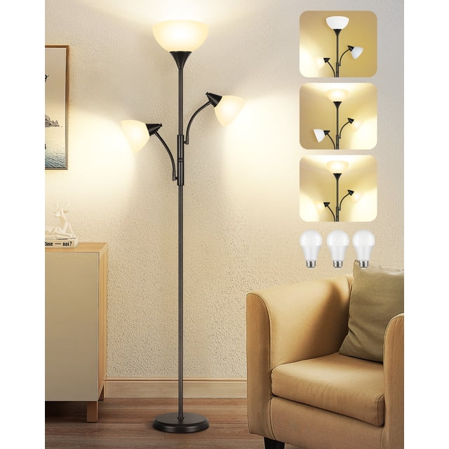 OUTON Torchiere Floor Lamp with Reading Light for Living Room, a black LED standing lamp with remote control and three adjustable lamp heads. The torchiere lamp provides ambient lighting, while two flexible gooseneck reading lights offer focused illumination. Features dimmable LED bulbs with adjustable color temperatures, ideal for living rooms or bedrooms. Positioned in a cozy living room setting next to a beige armchair and wooden side table.