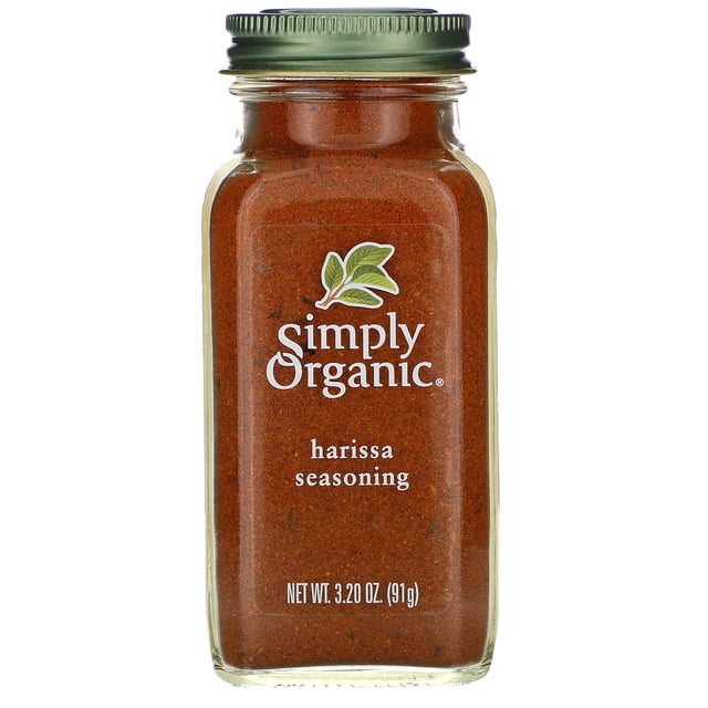 Simply Organic Harissa Seasoning, 3.20 oz (91 g), packaged in a clear glass jar with a green metal lid. The jar highlights the rich red spice blend, featuring the Simply Organic logo and USDA Organic certification.