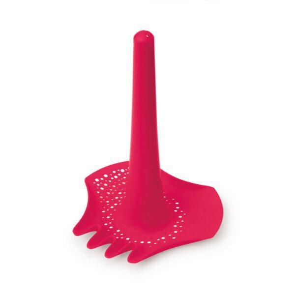 Quut - Triplet - 4-in-1 Beach Toy in bright red, a multifunctional sand tool combining shovel, rake, perforated sifter, and tall funnel handle for digging, sifting, raking, and funneling water or sand, suitable for beach or sandbox play.