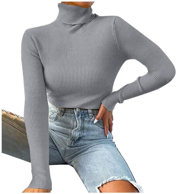 TIMIFIS Womens Long Sleeve Turtleneck Shirt in grey, featuring a slim fit design with ribbed texture and lightweight acrylic material. This women's top has a turtleneck collar and long sleeves, styled for casual or active wear during fall and winter seasons. Suitable as an undershirt or standalone top, paired with distressed denim shorts in the image.