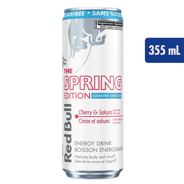 Red Bull Boisson Énergisante Sans Sucre Cerise et Sakura 355 ml en Canette avec logo Taureau Argenté sur Fond Blanc, Bord Bleu Étiqueté Sans Sucre, et Texte Édition de Printemps Rouge Mettant en Valeur la Saveur Cerise et Sakura, Convient pour Stimuler l'Énergie et la Concentration.