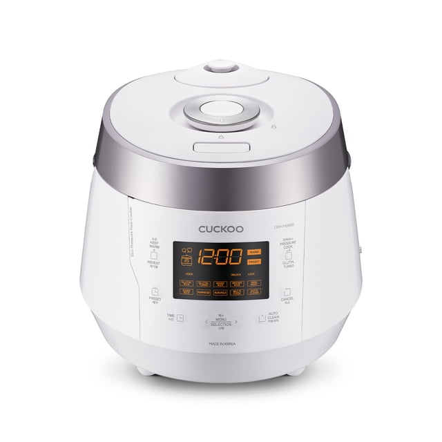 Cuckoo CRP-P1009SW 10 Cup uncooked Electric Heating Pressure Cooker & Warmer in a modern white and silver finish. The front panel displays an LED screen with touch controls for 12 cooking programs, including white rice, brown rice, GABA rice, and porridge. Designed for family use, it has a 10-cup uncooked capacity (20 cups cooked). The stainless steel inner pot is nonstick, scratch-resistant, and promotes even heat distribution. Accessories include a measuring cup, rice scoop, steam plate, and cleaning pin. Voice guidance is available in English, Chinese, and Korean for added convenience.