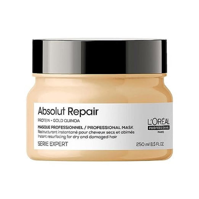 L'Oreal Professionnel Absolut Repair Hair Mask 250 ml in a beige jar with a black lid, featuring text highlighting its professional formula with protein and gold quinoa for repairing dry and damaged hair. This hair treatment is designed for medium to thick hair, providing shine, softness, and deep nourishment.