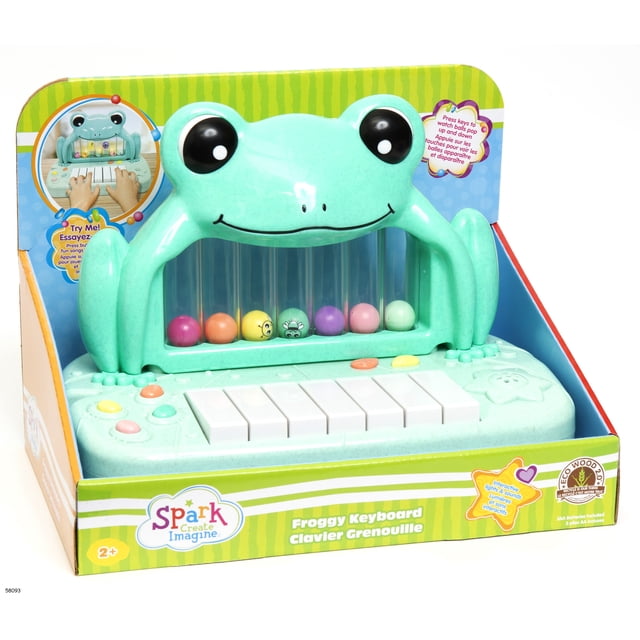 Spark Create Imagine Froggy Musical Keyboard for Kids Ages 3 to 6 featuring a light green frog-shaped design with eight white keys sized for small hands, colorful buttons, and a clear panel displaying multicolored balls that pop up and down for interactive music play, ideal for early learning and fine motor skill development, packaged in a bilingual English-French box.
