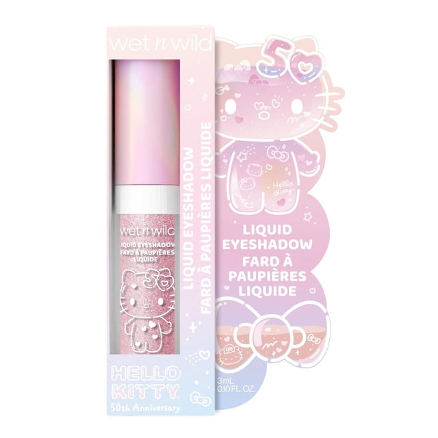 Hello Kitty Liquid Eyeshadow by wet n wild, a 3 ml (0.10 fl oz) liquid eyeshadow in a pink shimmer shade with a smooth, pigmented formula, in a clear tube with Hello Kitty design and pastel pink cap, packaged in a pastel gradient box celebrating Hello Kitty's 50th anniversary with bilingual English and French text.