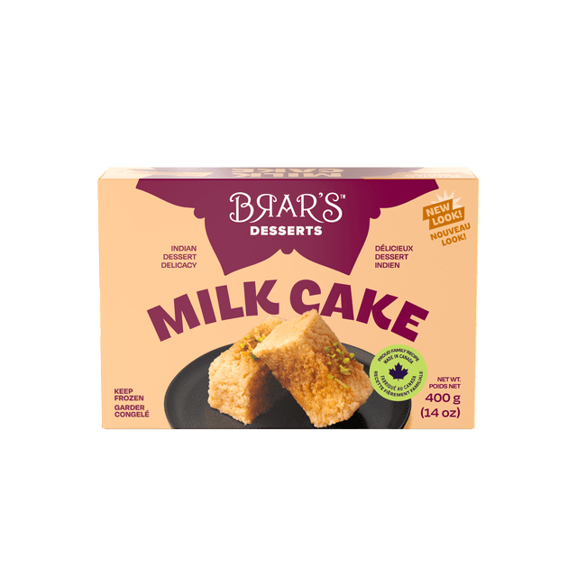 BRAR'S MILK CAKE box displaying two small square pieces of dense, moist, caramelized traditional Indian milk cake garnished with chopped pistachios on a black plate, labeled as an Indian dessert delicacy, 400g (14 oz), with a note to keep frozen.