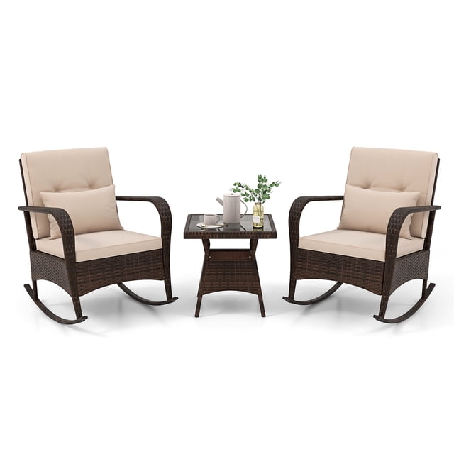Gymax 3PCS Outdoor Rocking Set featuring two rattan rocker chairs with beige cushions and lumbar pillows, and a matching coffee table with a tempered glass top. The chairs have ergonomic curved armrests and anti-slip stoppers for safe rocking. The set is crafted with mix brown PE rattan and a sturdy metal frame, ideal for outdoor patios or gardens. Dimensions of the rocking chair are 32'' x 26.5'' x 34'' (L x W x H), and the coffee table measures 20'' x 20'' x 20'' (L x W x H).