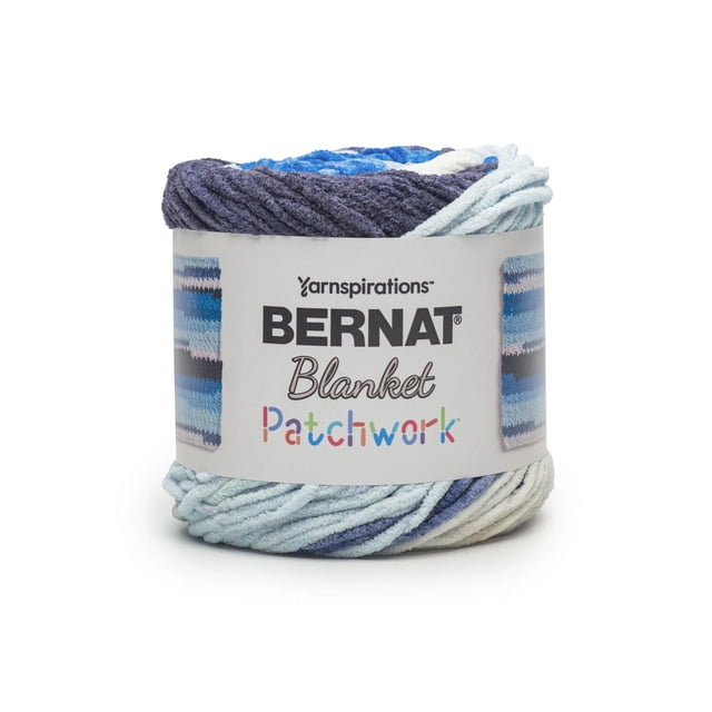 Bernat® Blanket Patchwork™ #6 Super Bulky Polyester Yarn in variegated blue, navy, and white chenille texture, 10.5oz/300g, 220 yards, shown as a thick skein with a label featuring the brand and patchwork pattern, suitable for knitting or crocheting soft blankets, pillows, and cozy home decor.