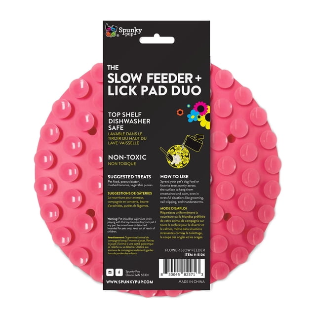 Slow Feeder - Lick Pad Combo Dog Toy by Spunky Pup, a pink circular silicone lick pad with raised suction cups designed for slow feeding and calming. Dishwasher safe and non-toxic, ideal for spreading dog food or treats evenly to soothe dogs during grooming or stressful situations.