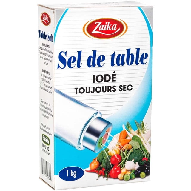 Zaika Iodized Table Salt, 35.27 Oz (1 KG) All-Natural Salt Coarse – Cooking and Seasoning Table Salt Pure Fine-grain iodized rock salt with uniform pale-white crystals, shown as a small heap on a wooden counter beside a clear shaker; product specs state no additives or anti-caking agents, suited for precise baking measurements and tabletop seasoning, often used as a pantry staple.