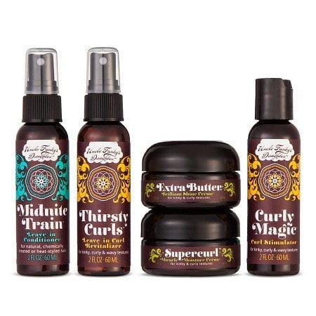 Uncle Funky's Daughter Ultimate Travel Kit 5 piece, featuring five travel-sized hair care products for curly and textured hair. Includes two spray bottles labeled 'Midnite Train' and 'Thirsty Curls,' and three jars labeled 'Extra Butter,' 'Supercurl,' and 'Curly Magic.' Each product is designed for hydration, styling, and curl definition. The items are arranged against a white background.
