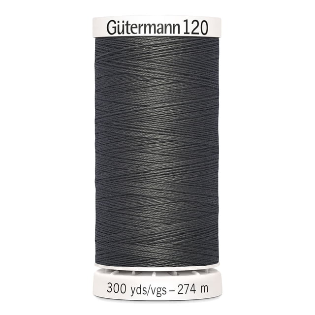 Gutermann 120 100% polyester all purpose thread spool in grey, tightly wound with a smooth finish, labeled 300 yards (274 meters), ideal for machine and hand sewing on cotton, synthetics, and wool fabrics, also suitable for craft and DIY projects.