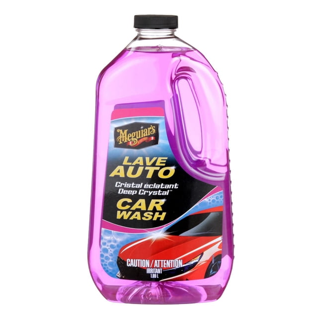 Meguiar’s® Deep Crystal™ Car Wash, G10464C, pink, 64 fl. oz. (1.89 L) in a translucent pink plastic bottle with a black screw cap and built-in handle, labeled in English and French with a red car image, featuring a pH-neutral, non-streaking formula that safely removes dirt and preserves wax protection for a bright, dazzling finish.