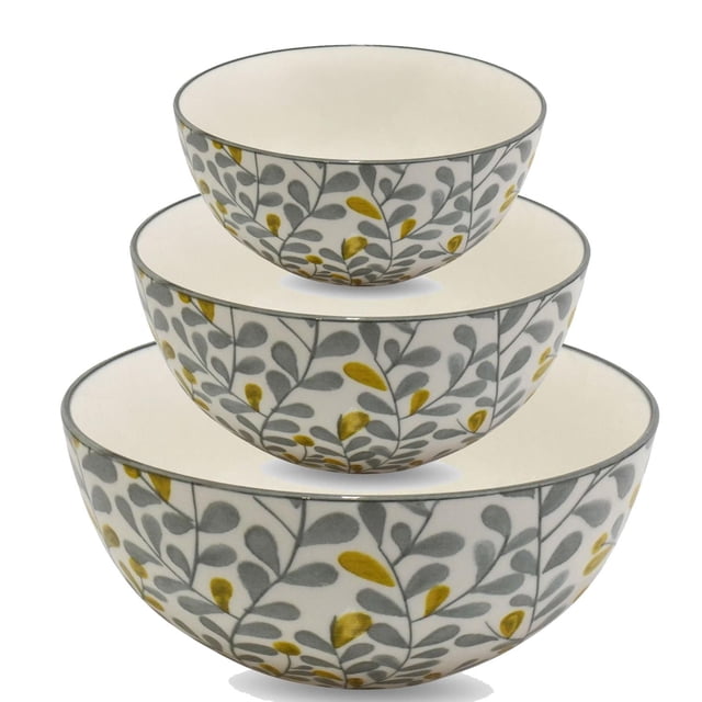 Ensemble de 3 Bols Milo (10 cm, 15 cm, 20 cm) avec Trois Bols en Porcelaine Empilés Présentant un Intérieur Blanc et un Extérieur Décoré de Motifs de Feuilles Grises et Jaune Moutarde, Va au Four jusqu'à 280 °C, Va au Lave-Vaisselle et au Micro-Ondes, Convient pour le Service et l'Usage Décoratif.
