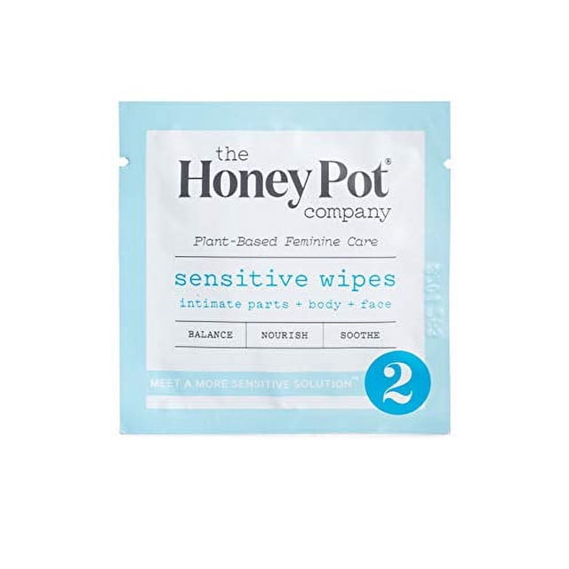 The Honey Pot Company Feminine Wipes - Sensitive, 15 Count. A light blue packet containing plant-based feminine care wipes for sensitive skin. Designed for intimate parts, body, and face, these wipes offer balance, nourishment, and soothing benefits. Not flushable but compostable.