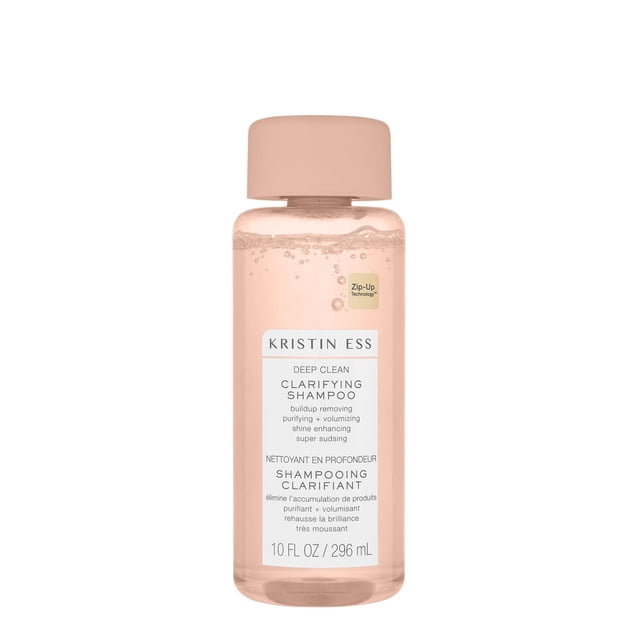 KRISTIN ESS DEEP CLEAN CLARIFYING SHAMPOO in a translucent light pink 10 fl oz (296 ml) bottle with a matching pink cap, featuring Zip-Up Technology and bilingual text describing its buildup removing, purifying, volumizing, and shine enhancing properties for deep hair cleansing.