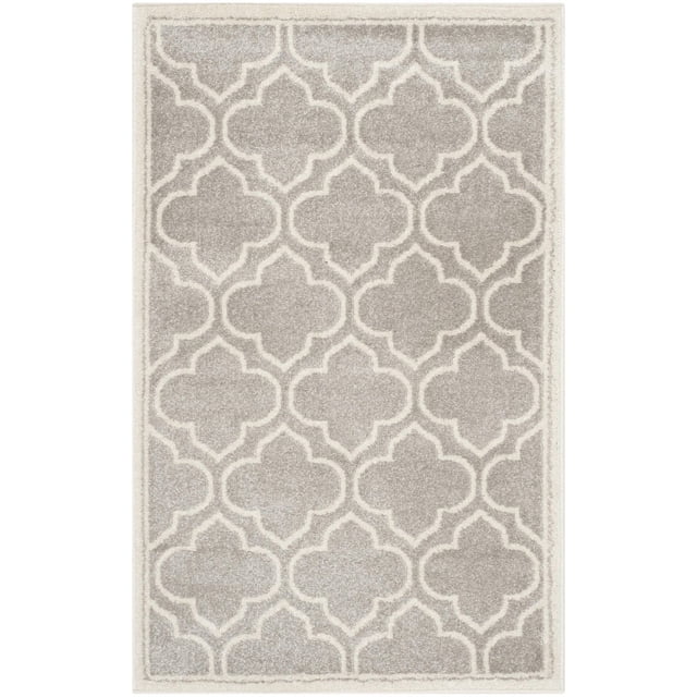 Safavieh Amherst Wilson Geometric Area Rug with a rectangular shape and repeating quatrefoil pattern in light grey and off-white, made of durable polypropylene for easy-care indoor-outdoor use, suitable for high-traffic home or office areas.