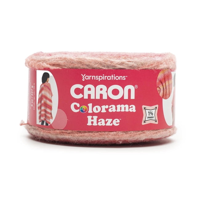 Caron® Colorama Haze™ Yarn, bulky #4 medium weight acrylic blend in an 8oz/227g skein with soft pink and peach tones, wrapped in a red label featuring knitting patterns and care details, suitable for knitting cozy shawls, sweaters, and accessories.