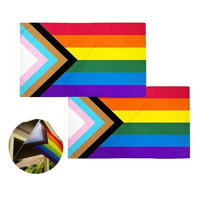 2 PCS Progress Pride Flag 3x5 Fts featuring a multicolour design with vibrant rainbow stripes and an inclusive chevron pattern in black, brown, pink, light blue, and white. Made of 100% polyester with double-stitched edges, strong headers, and two brass grommets for durability. UV-resistant dye ensures long-lasting colors, suitable for outdoor use. Includes two flags displayed flat and one shown mounted on a pole.