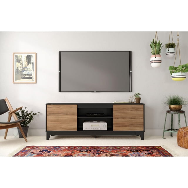 Nexera Rhapsody 72 inch TV Stand with black frame and natural wood doors, featuring two open shelves and a wire management opening, designed for TVs up to 80 inches, shown in a modern living room with a wall-mounted TV, hanging planters, and a colorful patterned rug, also suitable for organizing books and decorative items.