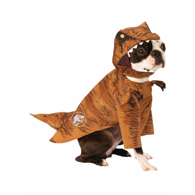 Jurassic World T-Rex Pet Costume for Dogs or Cats by Rubies featuring a small black and white dog wearing a brown scaly dinosaur jumpsuit with tiny attached T-Rex arms and an open-mouthed headpiece, sitting sideways on a white background with the Jurassic World logo on the tail, ideal for Halloween or themed events.