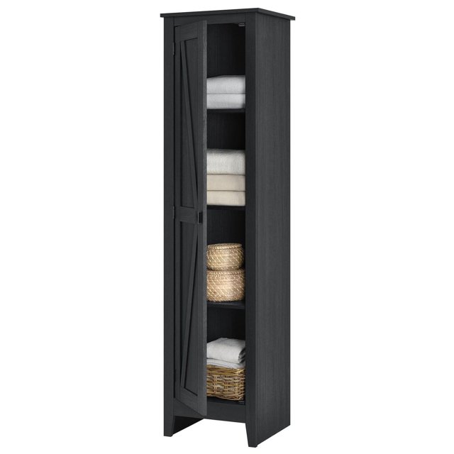 Systembuild Evolution Farmington 18-inch wide black oak storage cabinet with a barn-style door partially open revealing neatly folded towels and woven baskets on interior shelves.
