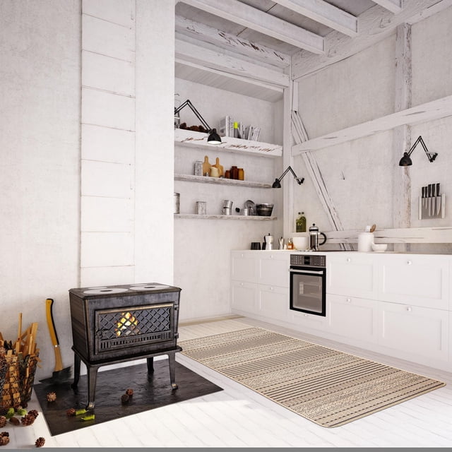 ECARPET kitchen, hallway, laundry room, entrance, kids room, bathroom mat & utility rug with non slip rubber backing in a rustic white kitchen featuring a black wood stove on a black hearth, white cabinetry with built-in oven, open shelves with kitchenware, and exposed white wooden beams. The geometric jute-style rug is durable, pet friendly, and ideal for high traffic areas.
