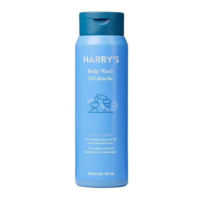 Harry's Stone Body Wash 473 ml in a blue plastic bottle with flip-top cap, featuring white text and a stacked stones illustration, offering a sulfate-free, deeply cleansing formula with an invigorating minerals and citrus scent for bath and shower use.