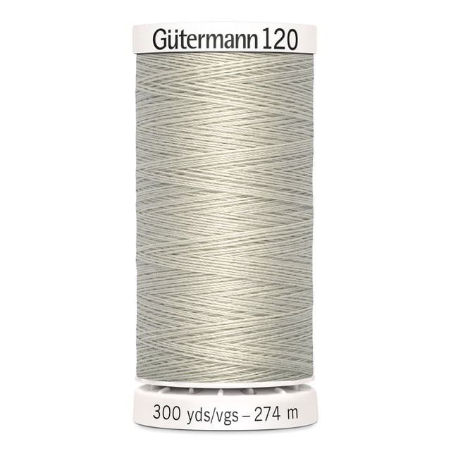 Gutermann 120 100% polyester all purpose thread spool in light grey, tightly wound with label showing 300 yards (274 meters), suitable for machine and hand sewing woven, knit, and synthetic fabrics, also ideal for craft and mending projects.
