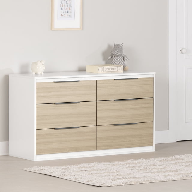 South Shore Hourra 6-Drawer Dresser for Child in soft elm and white with six large drawers and slim metal handles, ideal for organizing kids' clothes and essentials, shown in a neutral room with a beige rug, framed alphabet print, piggy bank, Scrabble box, and stuffed hippo on top.